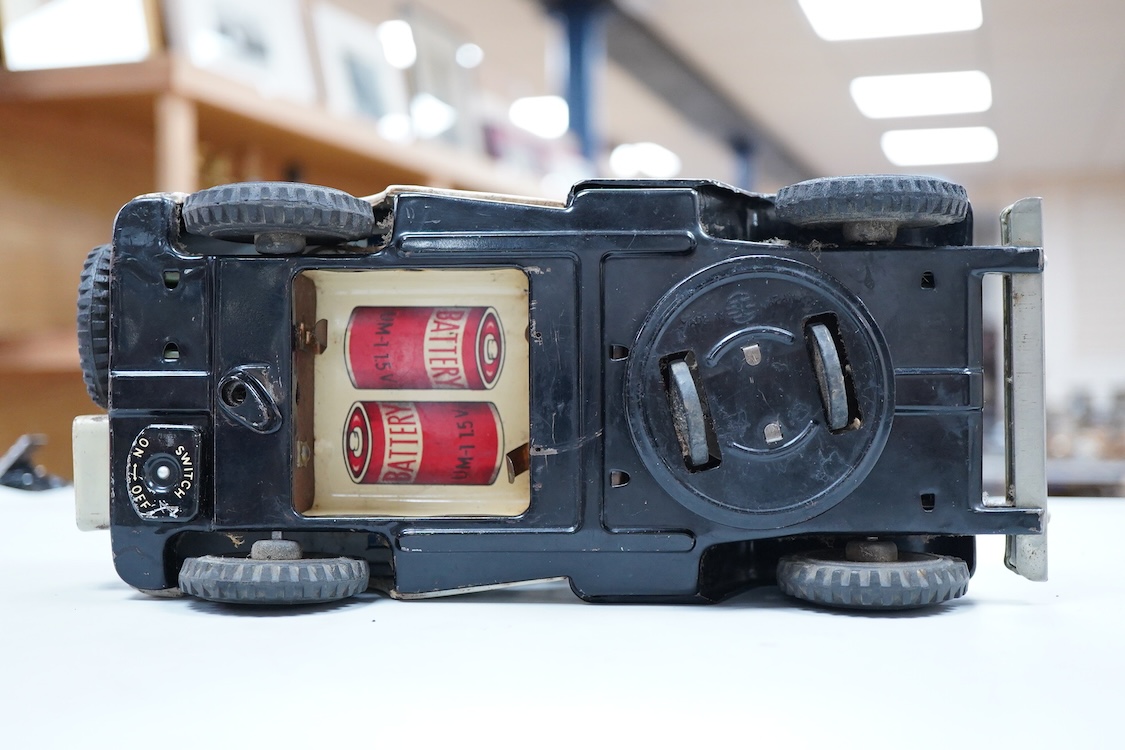 A 1960s Japanese T.N. Nomura battery powered tinplate and plastic Police Department Jeep, impressed manufacturer’s logo and ‘Made in Japan’ to the base